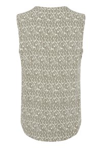 Haut beige sans manches avec un motif géométrique abstrait en marron clair et un col arrondi.