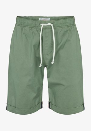 Zielone bawełniane szorty z elastycznym pasem, zapięciem na sznurek i podwiniętymi nogawkami. Posiadają kieszeń z przodu i kontrastujące kolorystycznie akcenty.