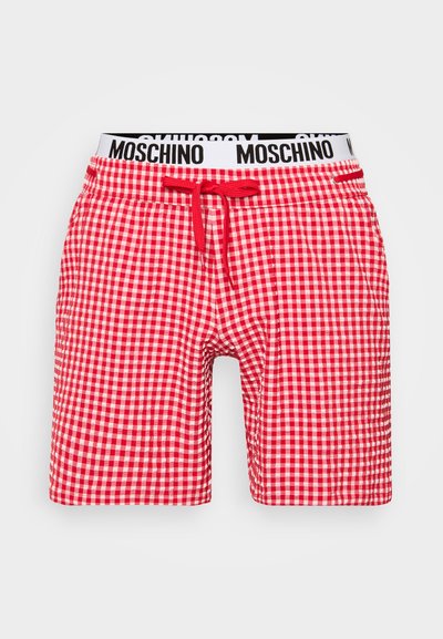 Raudoni ir balti langeliai šortai su elastine juosmeniu ir raišteliu. Yra kontrastingas juodas logotipas juosmens srityje.