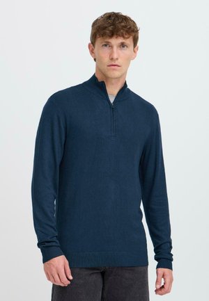 Navy blue zip-up sweater with long sleeves, ribbed cuffs and hem, made from textured fabric, featuring a short collar.