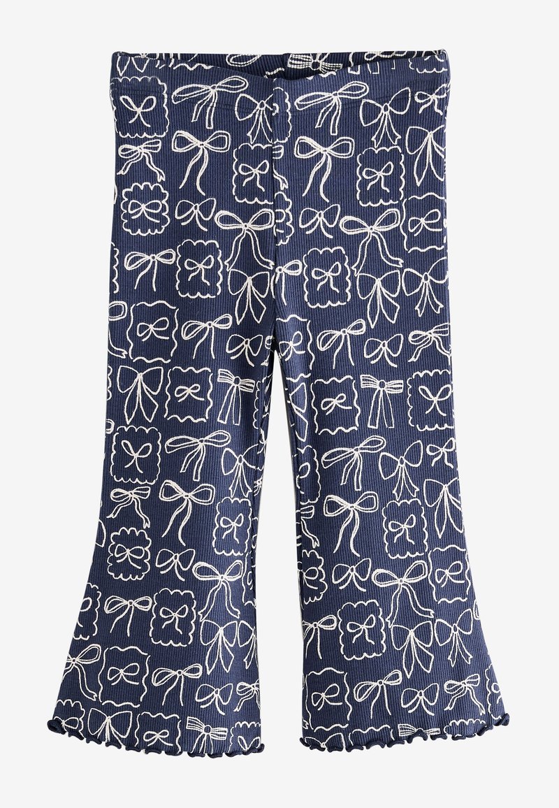 Pantaloni blu a coste con un motivo di fiocchi bianchi, caratterizzati da orli svasati e un bordo arricciato. Vita elastica per il massimo comfort.