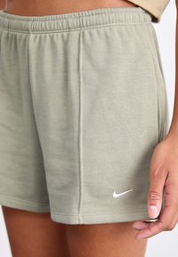 Nike Sportswear Calças de fato de treino - light army/sail