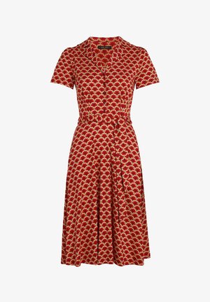 Red dress with short sleeves, featuring a leaf pattern in gold and cream. Includes a button front and tie belt at the waist.