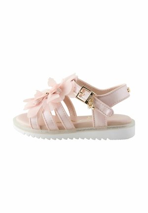 Rosa Sandalen mit floralen Akzenten, mehreren Riemen, einer Schnallenverschluss und einer durchsichtigen Sohle mit glitzerndem Rand.