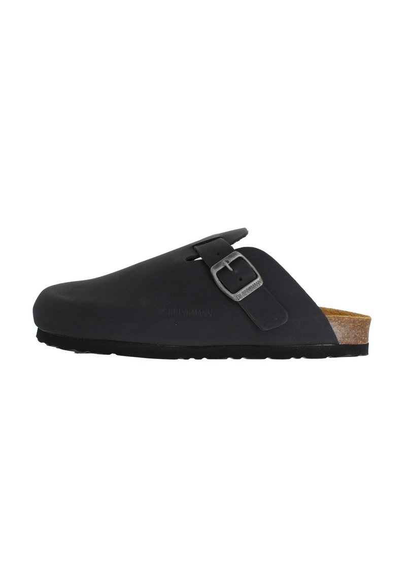 Sabot noir à enfiler avec une finition mate, boucle en métal réglable, semelle intérieure en liège ergonomique et semelle en caoutchouc. Pas de motifs ou d'accents visibles.