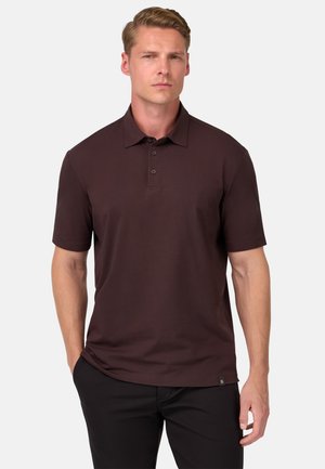 Polo a maniche corte di un elegante color bordeaux scuro. Presenta un colletto classico, una patta con tre bottoni e un discreto logo sul fondo.