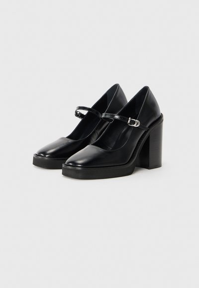 Cizme negre din piele tip Mary Jane, cu vârf rotund, curea de gleznă ajustabilă și toc rectangular, chunky, înalt.