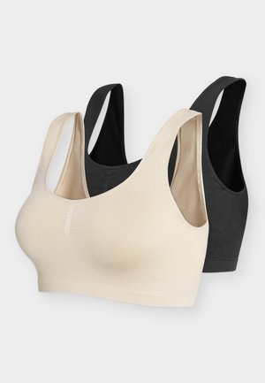 Kaks õmblusteta traadita rinnahoidjat beežis ja mustas värvitoonis, millel on laiad õlapaelad, esitletud lihtsal valgel taustal.