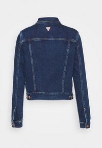 Dark blue denim jacket with a cropped design, visible stitching, and copper-tone button accents. Features a small logo at the back.