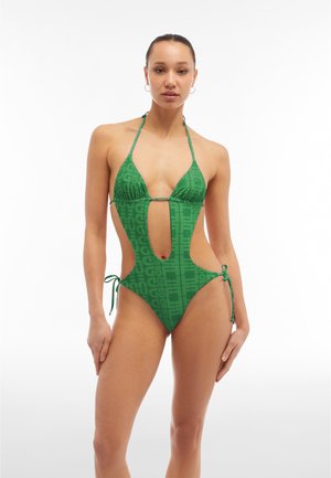 Green one-piece swimsuit with a logo pattern. Features a deep front cutout, side openings, and adjustable ties at the hips.