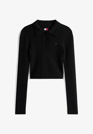 Camiseta polo cropped de manga larga negra con acanalados, tres botones frontales y pequeño logo de Tommy Jeans en el pecho.