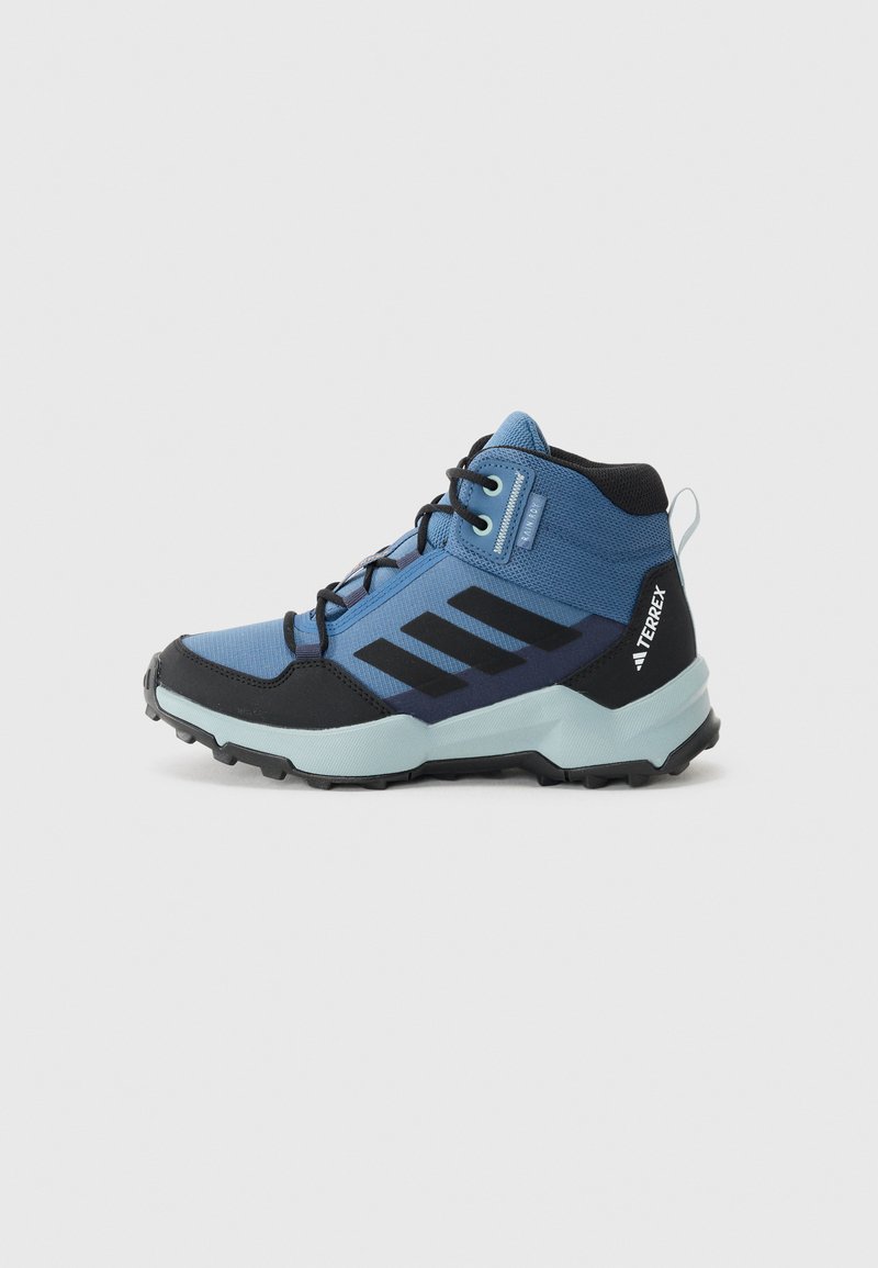 Hiking boots in blue with black accents, featuring a textured upper, prominent three-stripe design, and a rugged rubber sole for traction.
