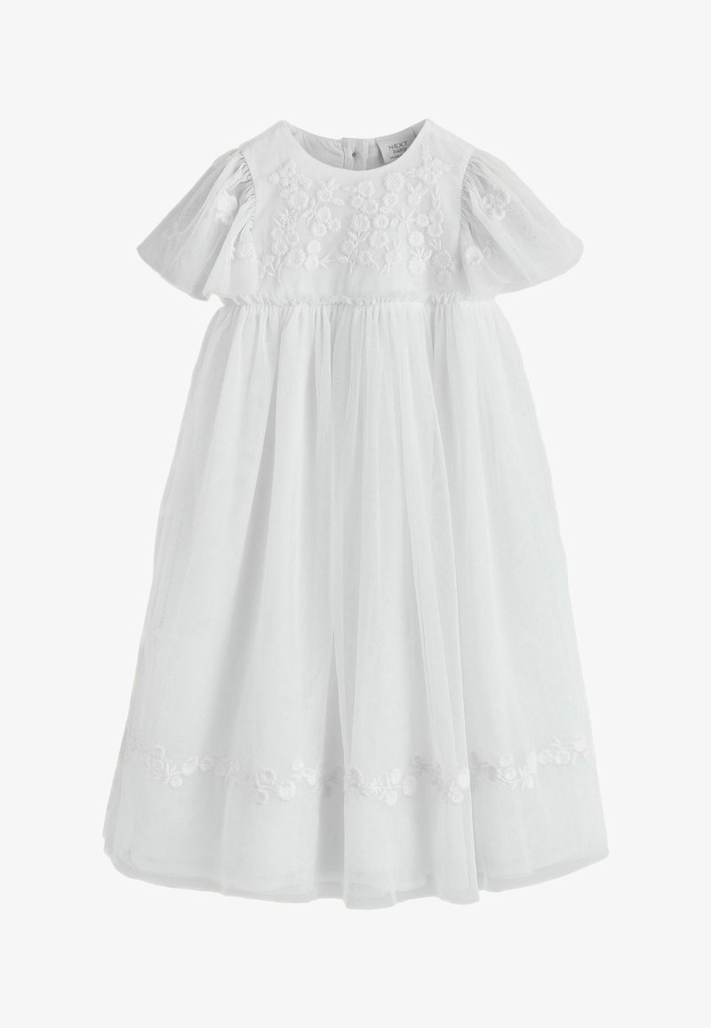 Fehér baba ruha rövid pöttyös ujjakkal, virágos hímzéssel a felsőrészen és az alján, valamint egy fodros tüll szoknyával.