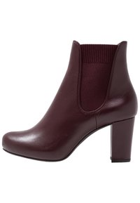 Burgundy ankle boot with a rounded toe, smooth leather upper, elastic side panel, and a sturdy block heel.