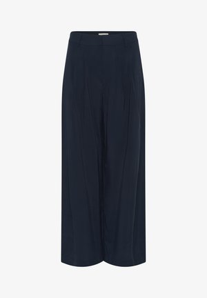 Sima anyagból készült tengerészkék bő szárú nadrág, magas derékkal, elöl redőkkel és egyenes sziluettel. Zsebek és díszítések nélkül.