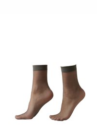 Tunna ankelsockar i ljusbrun färg med mörkbrun elastisk mudd. Slät textur, lågskuren design som visar tår och vristhöjd.