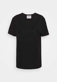 Camiseta de algodón negra con texto en relieve "ICEBERG" y "desde 1974", cuello redondo y mangas cortas. Tejido suave con un ajuste clásico.