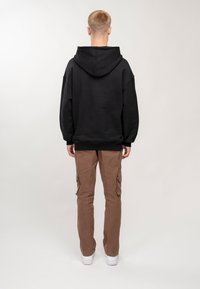 PEQUS Jersey con capucha - black