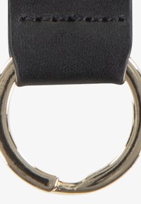 Black leather strap with visible stitching attached to a gold-tone metal ring. The strap is flat and smooth, emphasizing simple design features.
