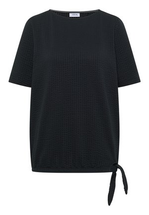 Haut noir texturé à manches courtes avec encolure ronde et détail de nœud sur le côté de l’ourlet, étiqueté « Cecil » à l’intérieur du col.