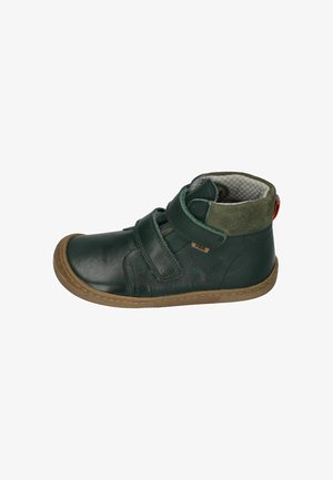Green leather ankle boot with two velcro straps. Features a brown rubber sole and a gray checkered lining with a green suede accent at the collar.