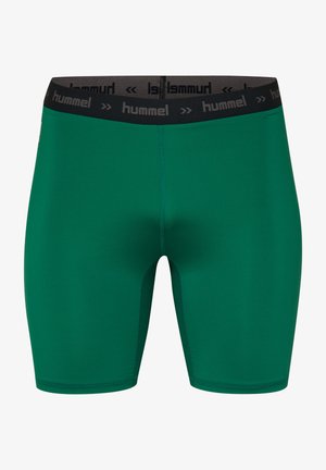 Grønne atletiske shorts med en tætsiddende design, lavet af glat stof. Har en sort talje med "hummel" logo. Søm-løs konstruktion.