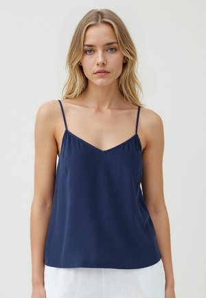 Canotta blu navy con spalline sottili regolabili, scollatura a V e vestibilità rilassata. Realizzata in tessuto leggero e texturizzato.