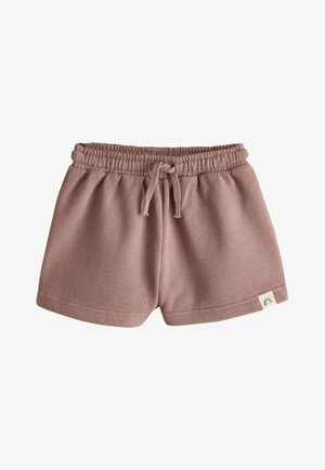 Pantaloni scurți moi pentru copii mici, de culoare liliac deschis, cu talie elastică și șnur, având o etichetă mică din material cu o pictogramă curcubeu pe tiv.