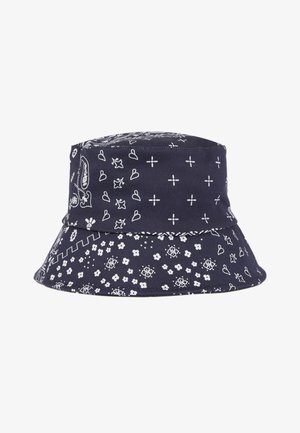Marineblå bøllehat med hvide paisley-, blomster-, hjerte- og korsmønstre, der dækker stoffet.