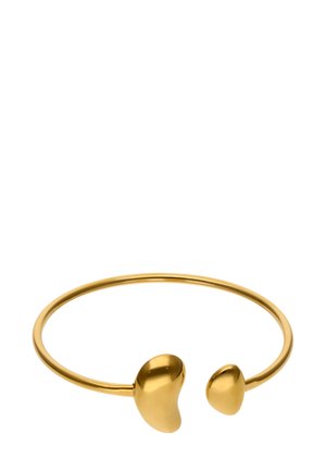 Gold metal cuff bracelet with a smooth, polished finish. Features two kidney-shaped accents at each end, creating a minimalist design.
