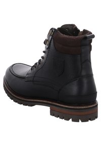 Black leather ankle boot with brown textile collar. Features a rounded toe, three metal eyelets, and a rugged rubber sole with traction.