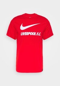 Camiseta de algodón roja con un gran logo en blanco de Nike y el texto "LIVERPOOL F.C." en una fuente blanca en negrita. Manga corta, corte estándar.