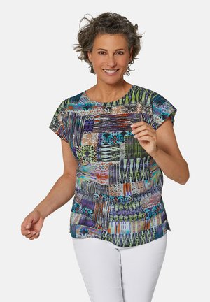 Korte mouwen top met een kleurrijk geometrisch patroon in groen, blauw, paars en oranje. Lichtgewicht stof en een relaxte pasvorm voor comfort.