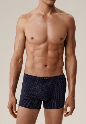 Granatowe bokserki w kropki, wykonane z miękkiej tkaniny. Posiadają wygodny pas i dopasowany krój, zapewniający idealne przyleganie.