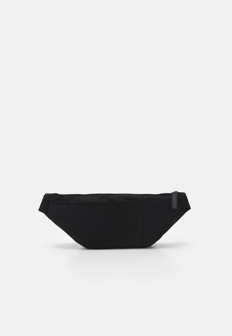 Black minimalist waist bag with zipper closure and adjustable strap, displayed on a plain white background.