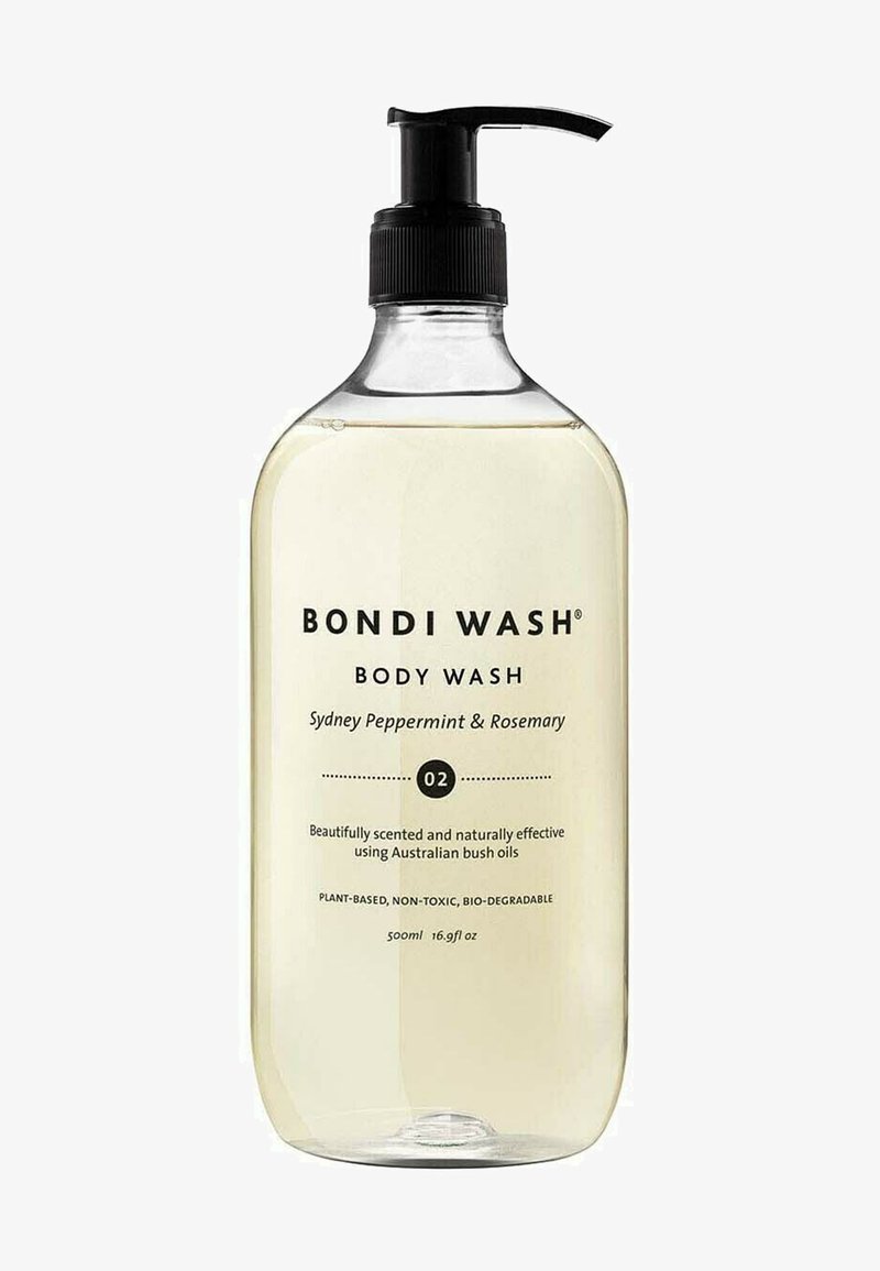 Bouteille cylindrique transparente de gel douche Bondi Wash, avec un bouchon-pompe noir, remplie de liquide jaune clair. L'étiquette indique le parfum et la taille.