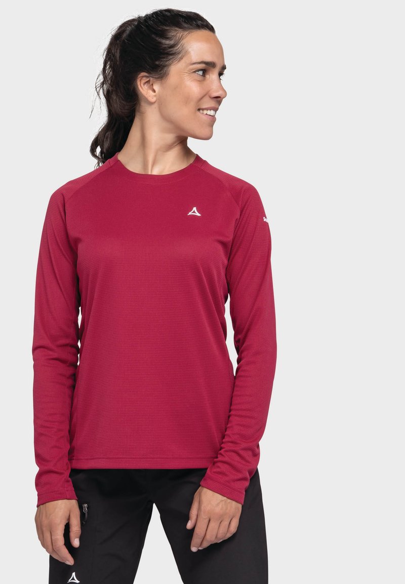 Langärmliges Sportshirt in tiefrot mit strukturiertem Stoff, Rundhalsausschnitt und weißem Logo auf der Brust. Entworfen mit Raglanärmeln.