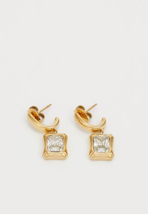Gold-tone earrings featuring square, clear crystal pendants set in a textured frame with a curved hook design.