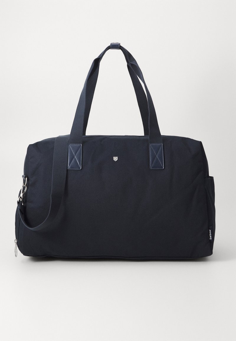 Navyblaue Canvas-Duffeltasche mit zwei Griffen, Schultergurt und Reißverschluss. Verfügt über eine minimale Markenpräsentation und Steppakzente an den Griffen.