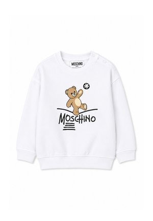 Bílá dětská mikina s hnědým medvídkem nad slovem Moschino černými písmeny a žebrovanými manžetami a límcem.