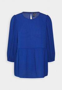 Blusa blu con maniche lunghe a sbuffo, scollatura tonda e dettaglio a chiave sul retro. Tessuto testurizzato con vita svasata e arricciata.