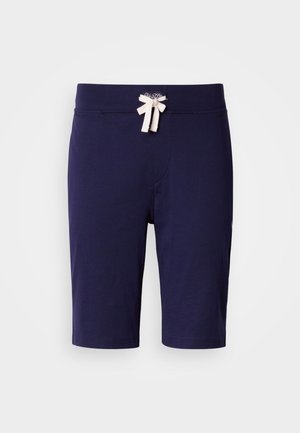 Marineblauwe korte broek gemaakt van zachte stof, met een taillekoord en een crèmekleurige strik. Soepele textuur, knielengte ontwerp.