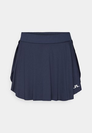 Marine tennis skjørt med plisserte detaljer, elastisk midje og logo på kanten. Laget av lett, pustende stoff.
