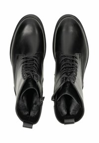 Bottines noires en cuir avec une finition lisse, dotées de lacets, de fermetures éclair et de languettes. Intérieur doublé d'un tissu doux pour plus de confort.