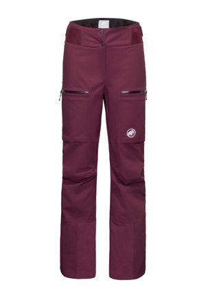 Pantaloni da sci color mogano con vita alta, due tasche con zip, gambe inferiori testurizzate e un logo circolare sulla coscia sinistra.