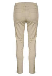 Pantalones ajustados beige hechos de mezcla de algodón, con una textura suave, cintura de talle medio y dos bolsillos traseros con solapas puntiagudas.