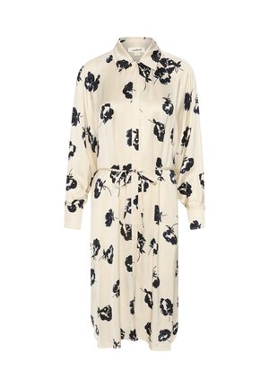 Cremefarvet skjortekjole med sort blomsterprint, lange ærmer, krave-udskæring og et bundet talje, der giver en justerbar pasform.