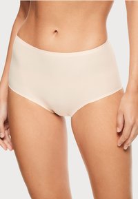 Light beige high-waisted briefs made of smooth, stretchy fabric. Features a clean finish, no visible seams, and a comfortable waistband.