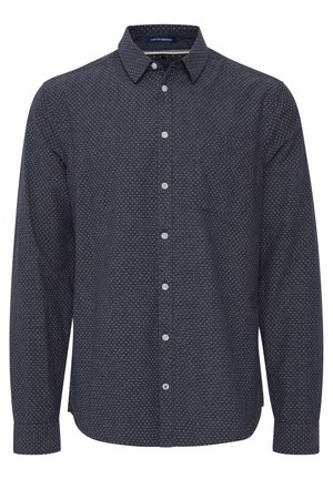Mörkblå långärmad skjorta med vitt geometriskt mönster, knappad krage, bröstficka och runda vita knappar. Mjuk tygtextur.