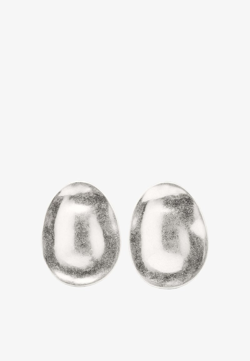 Round silver earrings with a polished, smooth texture and organic shape, featuring irregular surface patterns for added visual interest.
